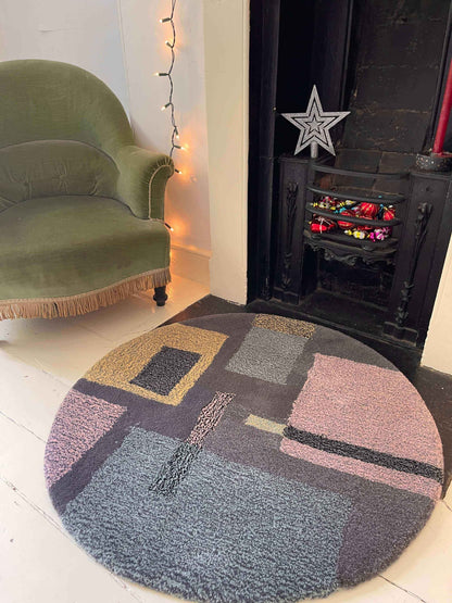 'Smog' Hand tufted grey pastel pink and yellow round small tufted rug