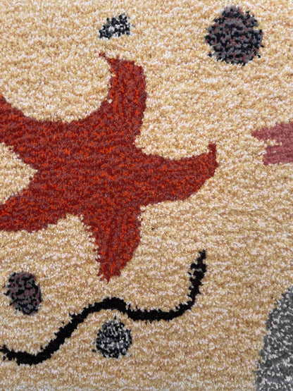 'Abyss' Star Fish sandy yellow tufted rug