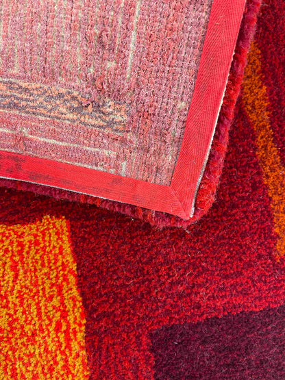'Flare' Hand tufted burgundy, red and orange small tufted rug