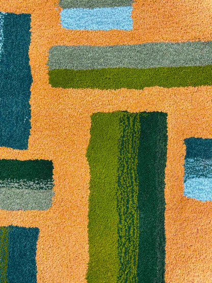 'Hitomi' Hand tufted ochre mustard, dark green and teal circular small tufted rug